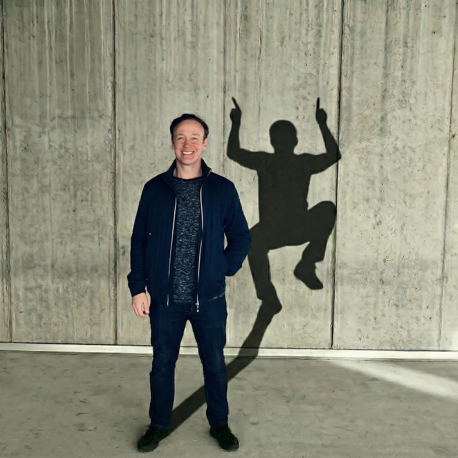 Jay Ozer standing beside his shadow